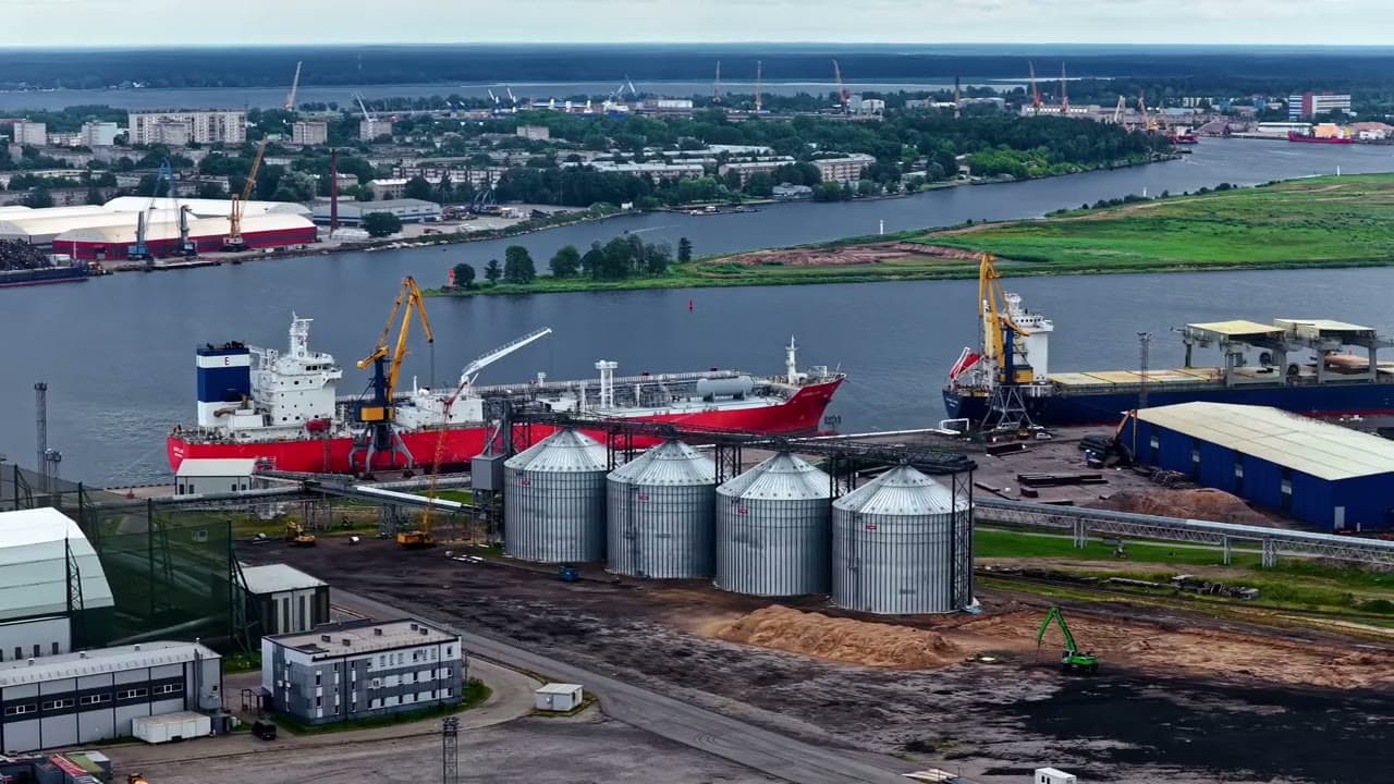 Aerial view of a coastal fuel terminal with tankers at berth